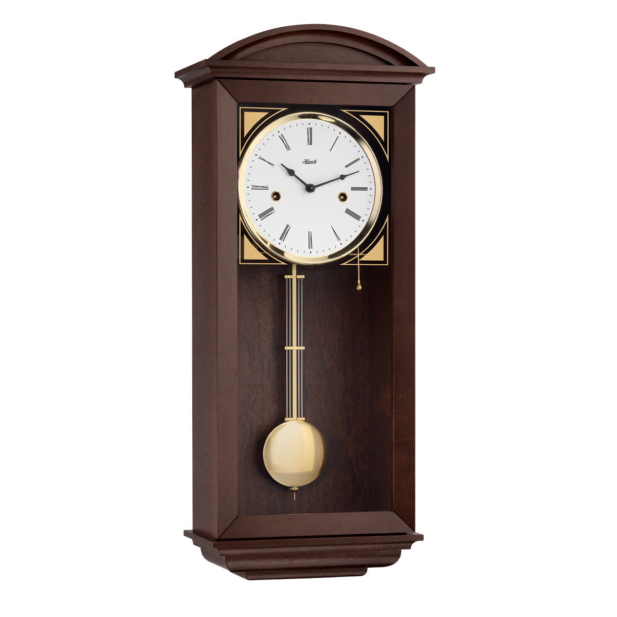 Retro style walnut wall clock with brass highlights and two holes in the face for winding the mechanical movement inside.