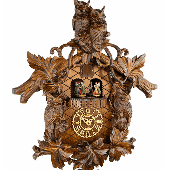 Close-up of Trenkle Wachter owl cuckoo clock with dancing figurines