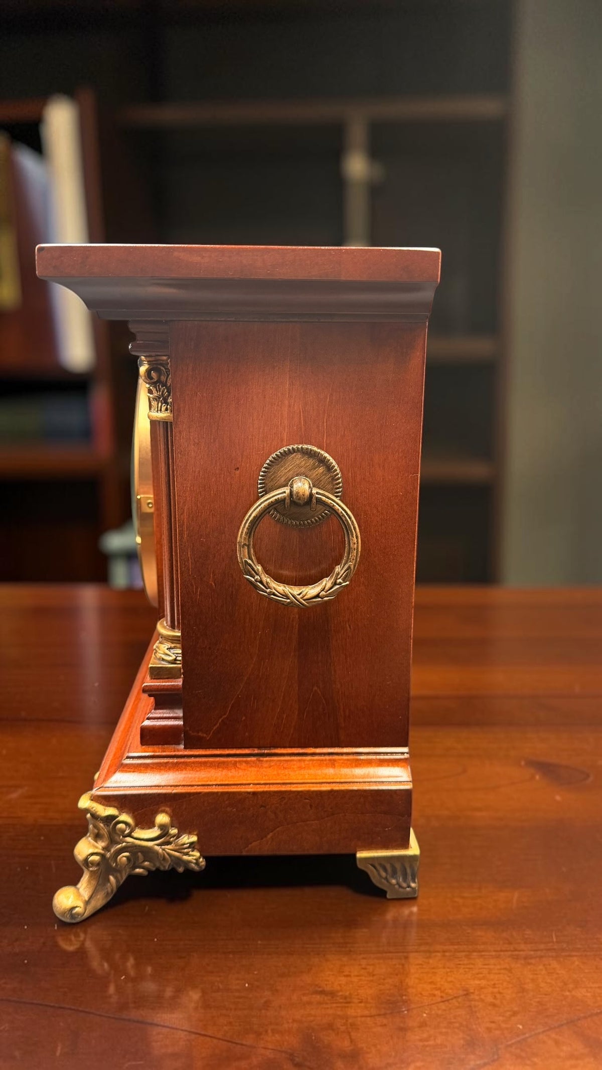 Opposite side of Howard Miller Circa clock with brass ring pull and wood case