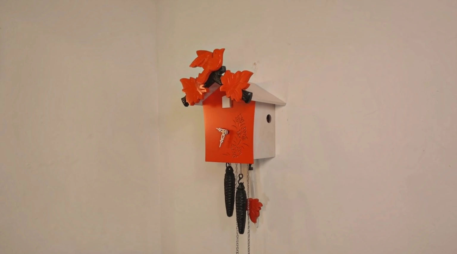 Orange Rombach & Haas Color cuckoo clock with black weights