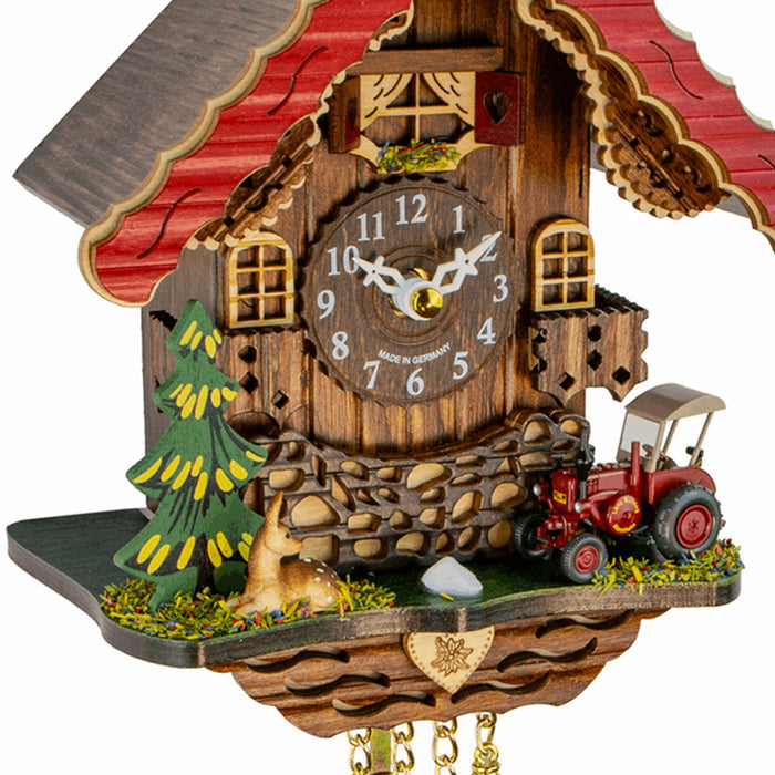 Close-up of Trenkle Bauer tractor and deer cuckoo clock