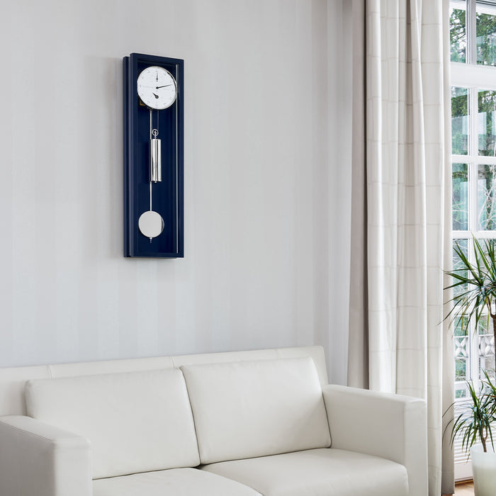 Hermle Emmette blue regulator wall clock displayed in a modern living room