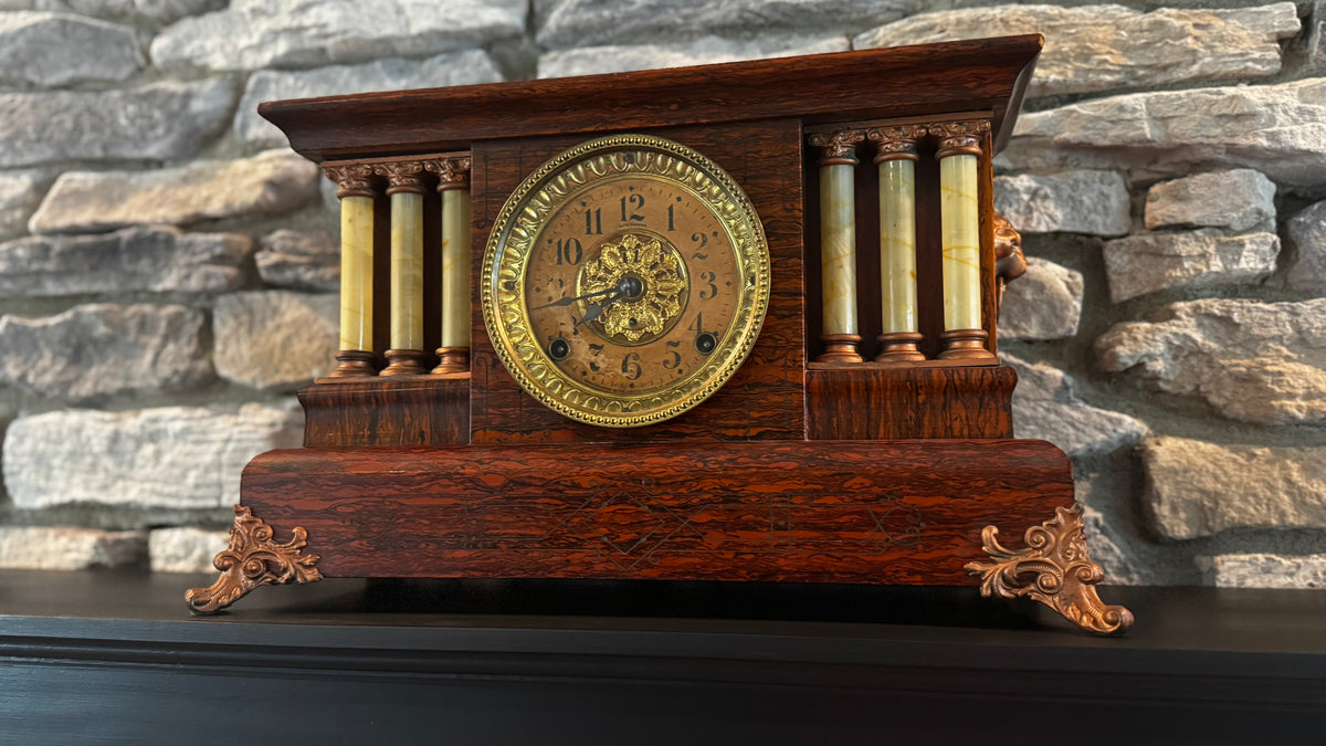 Memere’s ornate Seth Thomas mantel clock, with its wood case and decorative columns, on Andy’s mantel.