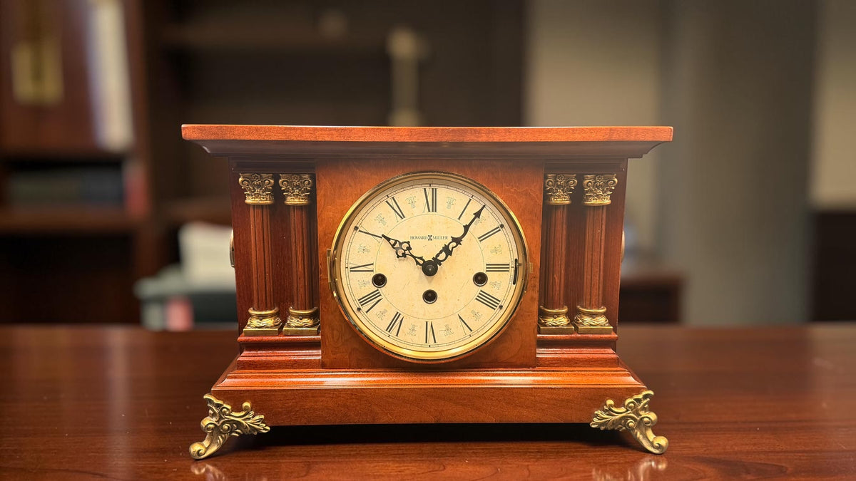Howard Miller Circa 630-212 vintage mantel clock with Kieninger movement, fluted columns and ornate brass feet, front view