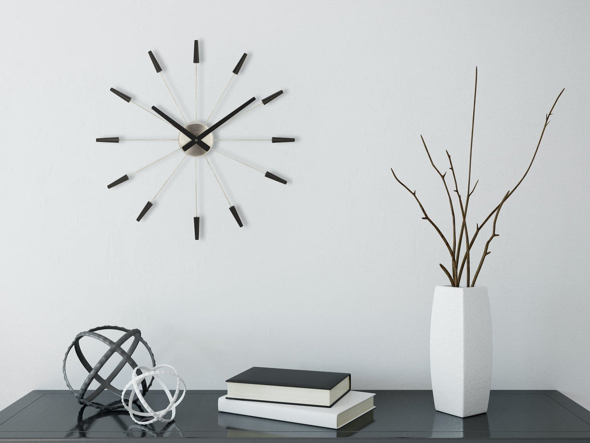 NeXtime Plug Inn wall clock above a console in a contemporary interior.
