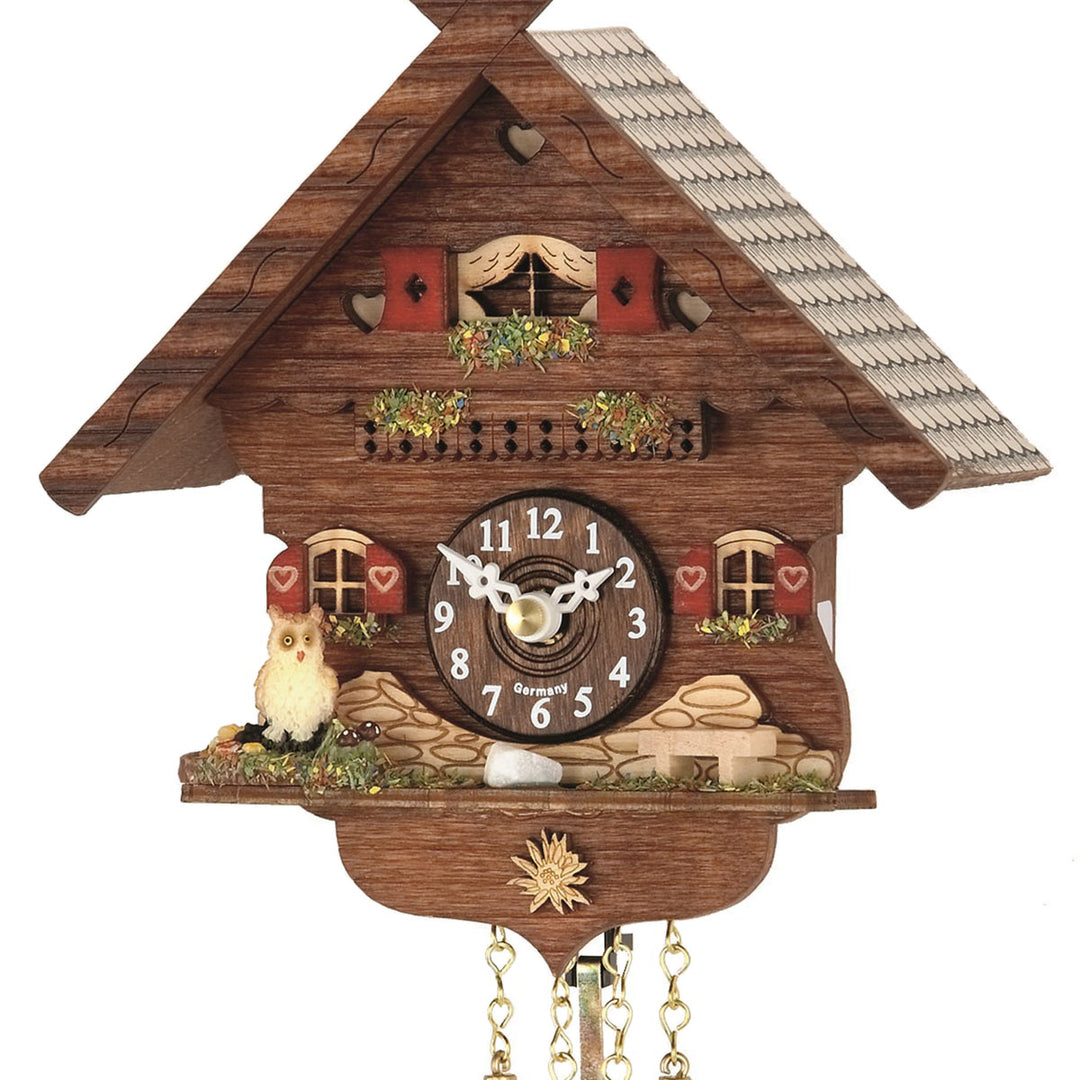 Close-up of Trenkle Otto German cuckoo clock with white owl and red shutters