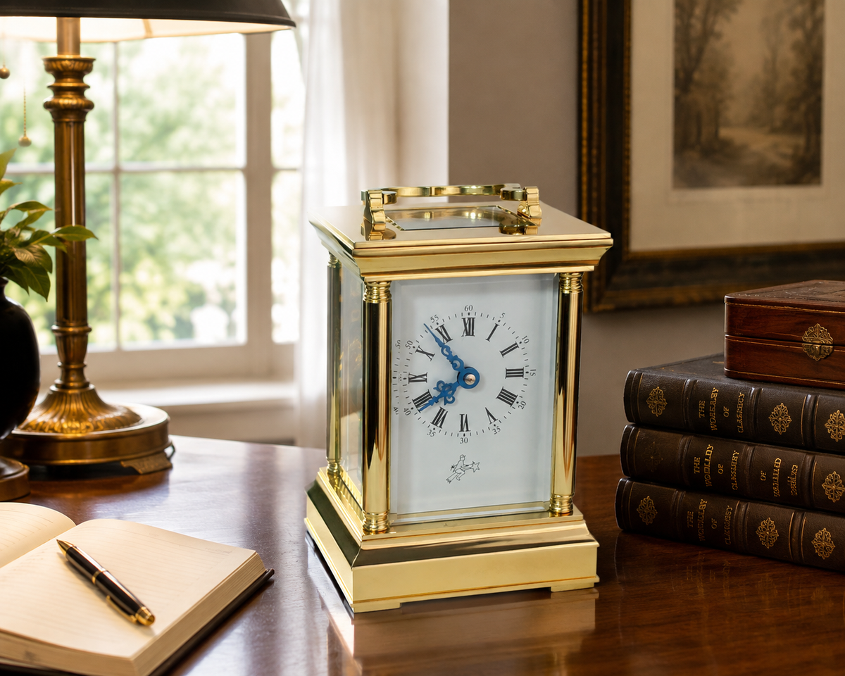 Sternreiter brass carriage mantel clock on a desk